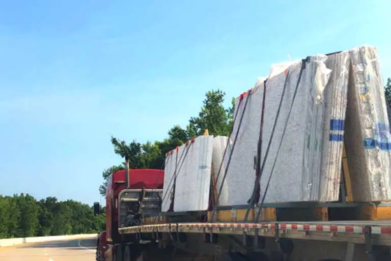 Shipping granite or marble slabs by flatbed trucks.