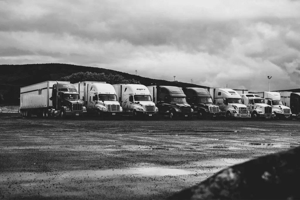 Various types of trucks in static motion.